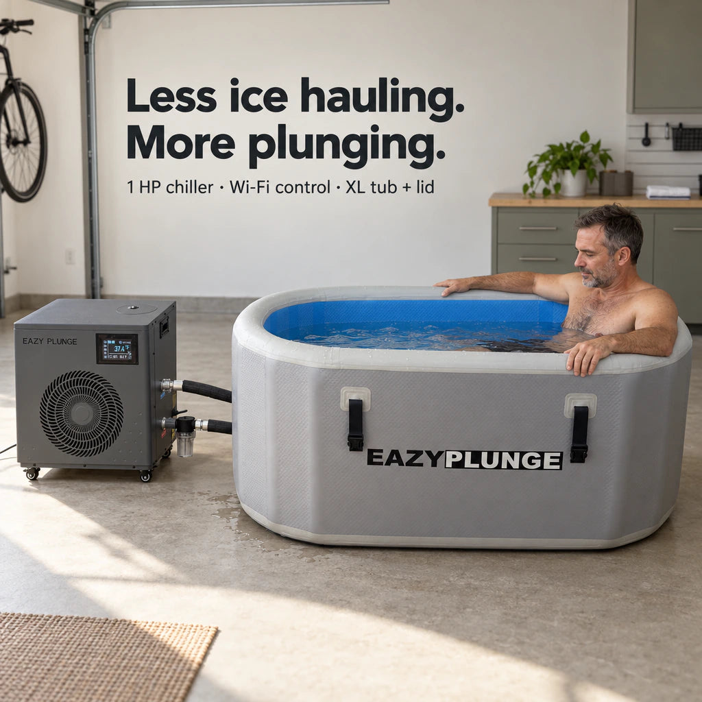 Eazy Plunge complete setup in a bright garage, with a middle-aged man seated inside the right end of the tub. Less ice hauling. More plunging. 1 HP chiller, Wi-Fi control, XL tub and lid.